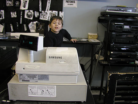 the little man working the register